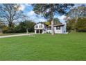 Two-story home with a spacious lawn and mature trees at 2611 Kings Cir, Lawrenceville, GA 30044