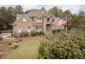 Brick two-story house with landscaped yard at 2194 Ne Indian Shoals Dr, Loganville, GA 30052