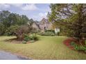 Brick house with large yard and American flag at 2194 Ne Indian Shoals Dr, Loganville, GA 30052