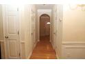 Bright hallway with hardwood floors and neutral walls at 832 Arbor Gate Ln # 832, Lawrenceville, GA 30044