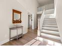 Bright foyer with hardwood floors and staircase at 2640 Joseph Dr, Cumming, GA 30028