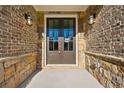 Elegant entryway with double doors and stone accents at 2640 Joseph Dr, Cumming, GA 30028