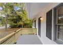 Inviting front porch with modern wood railing at 200 Sunrise Cir, Riverdale, GA 30274