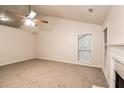 Bright living room featuring neutral carpet and a fireplace at 949 Heartwood Cir, Lawrenceville, GA 30043