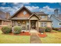 Charming craftsman style home with a covered porch and landscaping at 132 Tan Yard Rd, Social Circle, GA 30025