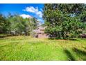 Spacious grassy yard with trees surrounding the home at 250 Big Oak Rd, Whitesburg, GA 30185