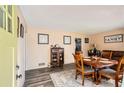 Bright dining area with wood table and chairs at 2376 Falls River Dr, Lithia Springs, GA 30122