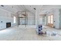 Unfinished living room in new construction home with high ceilings and fireplace at 3337 Horsley Mill Rd, Carrollton, GA 30116