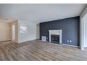 Living room with fireplace and wood-look flooring at 605 Augusta Se Dr, Marietta, GA 30067