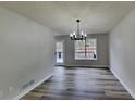 Bright dining room features hardwood floors and chandelier at 101 Hickory Leaf Ln, Acworth, GA 30101