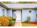 Front door entrance with landscaping at 1121 Whisper Wind Dr, Mcdonough, GA 30253