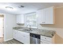 Updated kitchen with white cabinets and granite countertops at 3575 Bright Star Rd, Douglasville, GA 30135