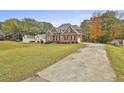 Two-story brick home with mature trees at 401 Highway 279, Fayetteville, GA 30214