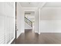 Bright entryway with hardwood floors and view to staircase at 3657 Lockaby Way, Lawrenceville, GA 30044