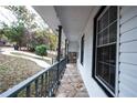 Covered porch with stone flooring and railing at 1143 Cedar Log Pl, Austell, GA 30168