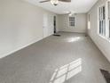 Spacious living room with neutral carpeting at 828 Pinevalley Dr, Forest Park, GA 30297