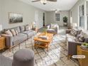 Virtually staged living room with comfy sofas and a coffee table at 828 Pinevalley Dr, Forest Park, GA 30297