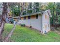 Ranch home with a brick exterior, nestled on a grassy lot with mature trees at 2648 Cavalier Dr, Decatur, GA 30034