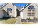 Brick house front with walkway and landscaping at 6687 Hill Creek Cv, Lithonia, GA 30058