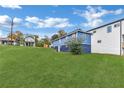 Back of the blue house showing a large grassy area at 406 Elm Nw St, Atlanta, GA 30314