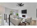 Modern living room with fireplace and vaulted ceiling at 2954 Lighthouse Ct, Acworth, GA 30101