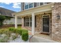 Inviting front porch with brick columns and landscaping at 3233 Harmony Hill Trce, Kennesaw, GA 30144