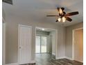 Living room with ceiling fan and access to a sunroom at 1072 Vincent Dr, Forest Park, GA 30297