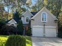 Two story house with double garage and landscaped yard at 2698 Claredon Nw Trce, Kennesaw, GA 30144