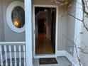 Inviting front entry with hardwood floors and oval window at 2698 Claredon Nw Trce, Kennesaw, GA 30144