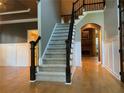 Grand foyer with hardwood floors and open staircase at 2698 Claredon Nw Trce, Kennesaw, GA 30144