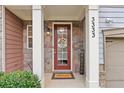Inviting front entry with stone accents and double doors at 3333 Castleberry Village Cir, Cumming, GA 30040