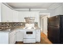 Updated kitchen with white cabinets, granite counters at 1852 E Farris Ave, Atlanta, GA 30344