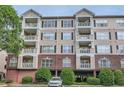 Three-story building with brick and siding, and parking below at 4333 Dunwoody Park # 3401, Dunwoody, GA 30338
