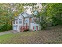 Two-story home with two car garage and front yard at 9444 Lakeview Ct, Douglasville, GA 30135