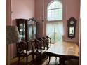 Formal dining room with large table, hutch, and large window at 2520 Conley Dr, Cumming, GA 30040
