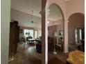 Spacious living room with vaulted ceilings, hardwood floors and arched entryways at 2520 Conley Dr, Cumming, GA 30040