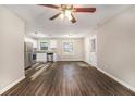 Open living area with wood-look floors and stainless steel appliances at 2648 Santa Monica Nw Dr, Atlanta, GA 30318