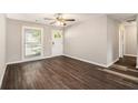 Spacious living room with dark hardwood floors and neutral walls at 2648 Santa Monica Nw Dr, Atlanta, GA 30318