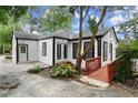 White house with black trim, deck, and walkway at 4118 Clairmont Rd, Chamblee, GA 30341