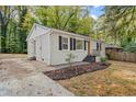 Brick ranch home with a freshly landscaped yard at 3018 Wanda Sw Cir, Atlanta, GA 30315