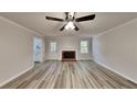 Spacious living room with fireplace and new flooring at 245 Southmoor Cir, Stockbridge, GA 30281