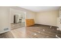 Open living room with a view into the kitchen at 245 E Simon Nw Ter, Atlanta, GA 30318