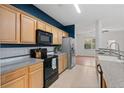 Kitchen with light wood cabinets, granite countertops at 2357 Bayrose Cir # 57B, East Point, GA 30344