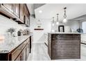 Modern kitchen with granite countertops and dark wood cabinets at 5483 Wylstream, Norcross, GA 30093