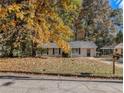Newly painted house with fall leaves in the yard at 2887 Rockcliff Se Rd, Atlanta, GA 30316