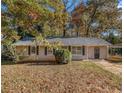 Newly painted house with fall leaves and trees at 2887 Rockcliff Se Rd, Atlanta, GA 30316