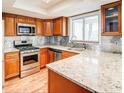 Modern kitchen with granite countertops and stainless steel appliances at 12 Rumson Ct, Smyrna, GA 30080