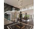 Grand entryway with marble floors, a curved staircase, and a wine cellar at 2251 Old Atlanta Rd, Cumming, GA 30041
