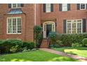 Brick front entrance with a black door and a brick walkway at 788 Old Paper Mill Dr, Marietta, GA 30067