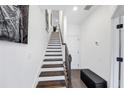 Modern staircase with dark wood treads and white risers at 3984 Allegretto Cir, Atlanta, GA 30339